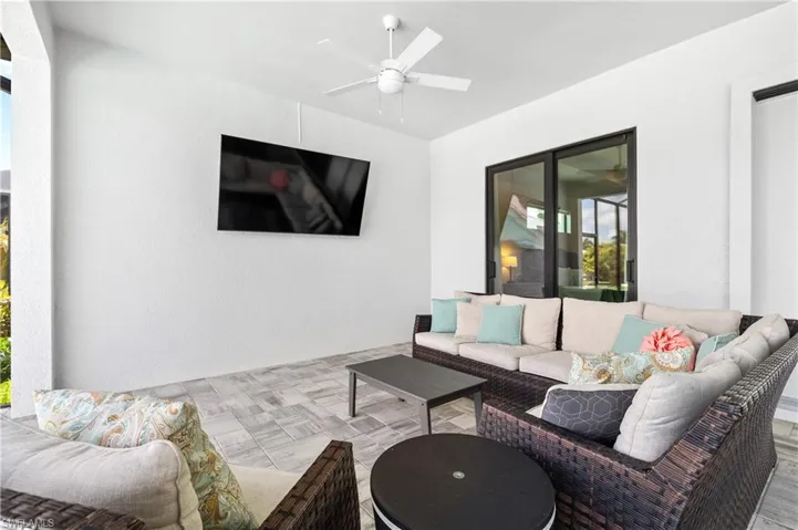 View of patio / terrace with an outdoor living space and a ceiling fan