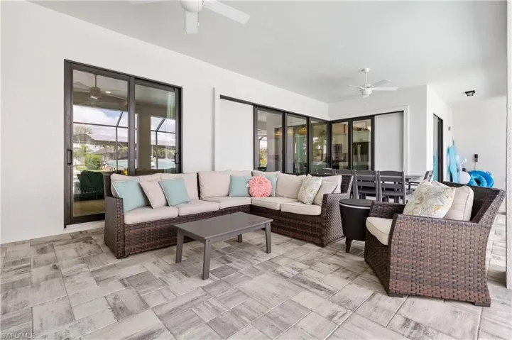View of patio / terrace featuring ceiling fan and an outdoor living / dining area
