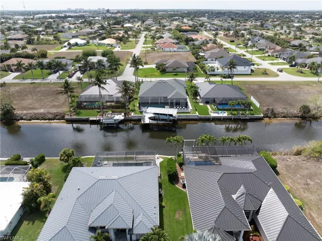 Aerial perspective of suburban area with a large body of water