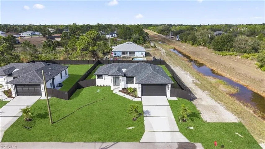 Aerial view of residential area with a nearby body of water