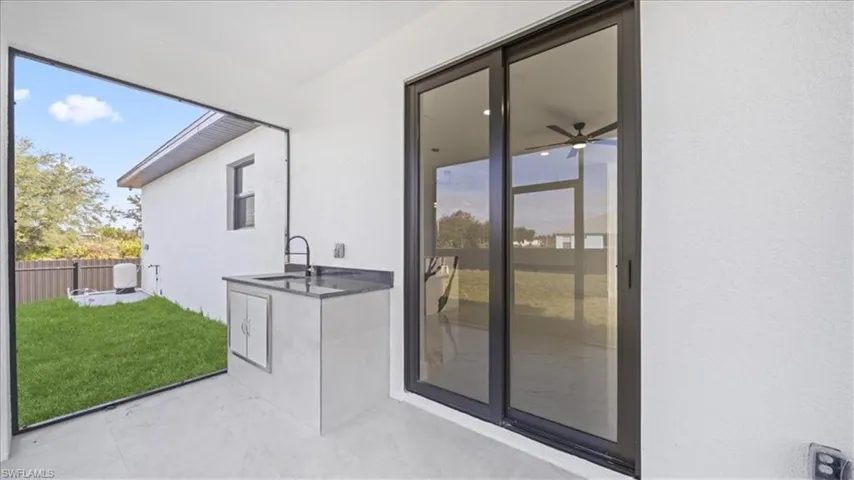 Unfurnished sunroom with a sink