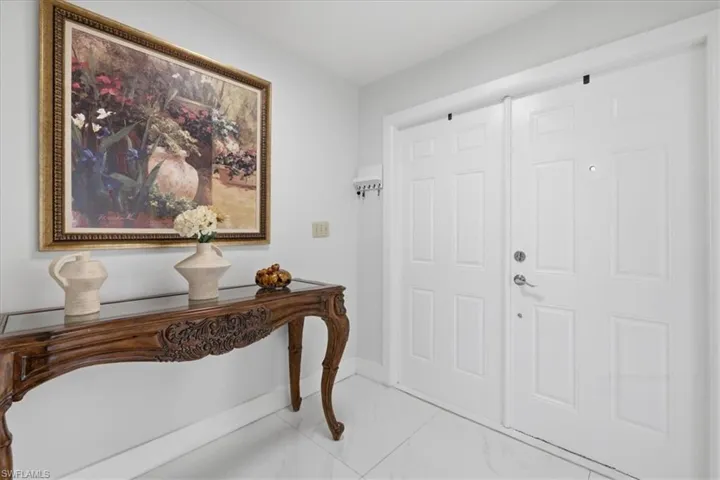 Foyer featuring baseboards