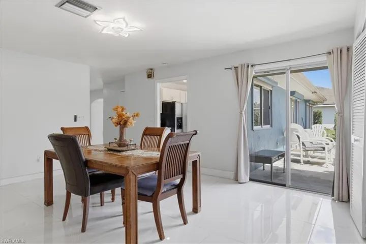 Dining space featuring baseboards and arched walkways