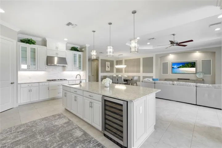 Kitchen featuring an island with wine cooler