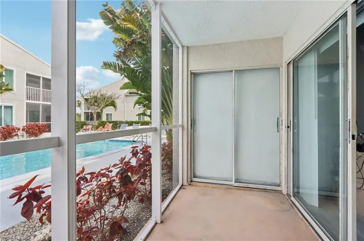 Balcony with view of pool area