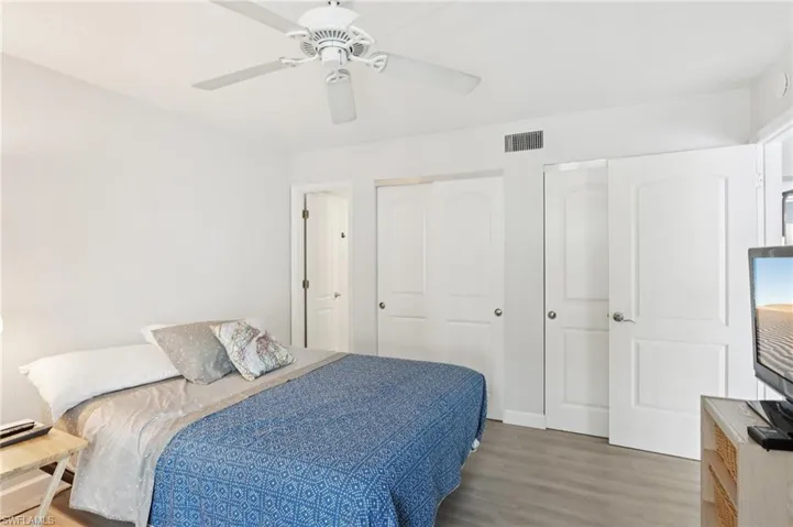 Bedroom featuring light wood-type flooring and ceiling fan