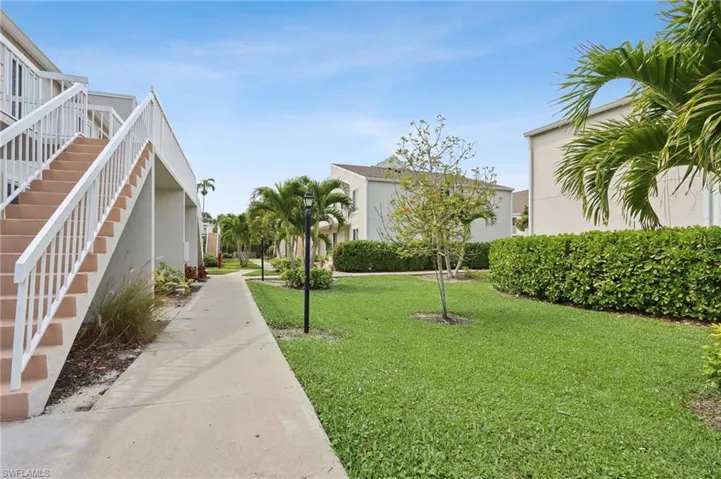 View of property's community featuring stairway