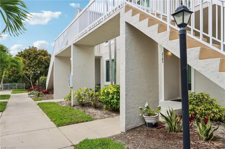View of side of home featuring stucco siding