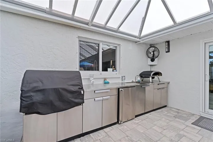 View of patio with grilling area and sink