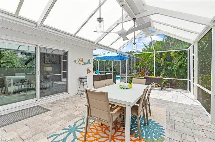 Sunroom featuring lofted ceiling