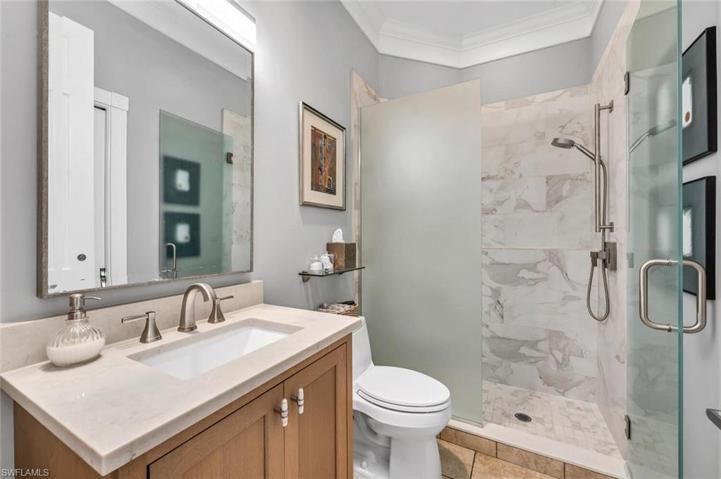 This bath serves as an en-suite or powder bath for guest.