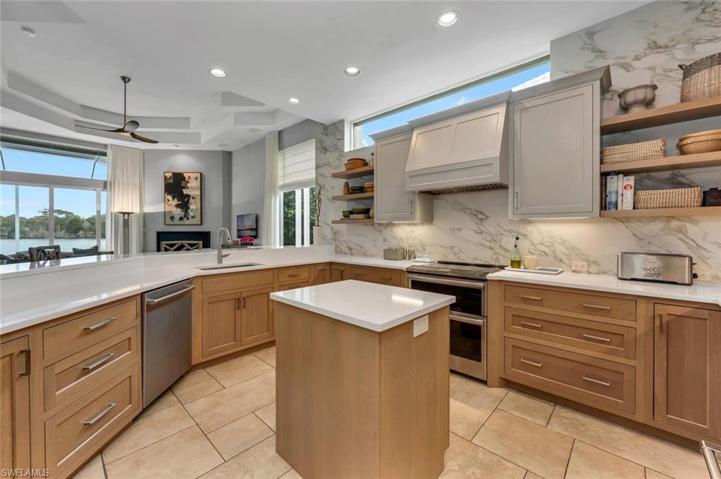 Custom White Oak cabinetry, Bainco Canvas Hanstone Quartz, Porcelain Wall Tile, Stainless Appliances.
