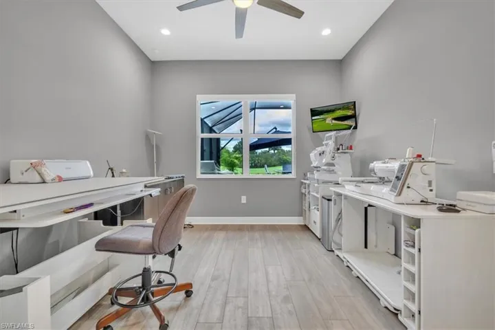 Home office with light wood finished floors, recessed lighting, and ceiling fan