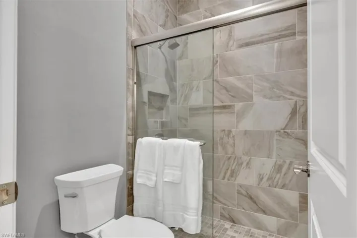 Bathroom with walk in shower and toilet