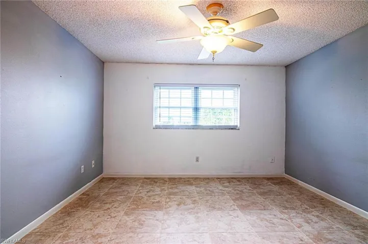 Nice natural lighting featuring tiled floor and ceiling fan