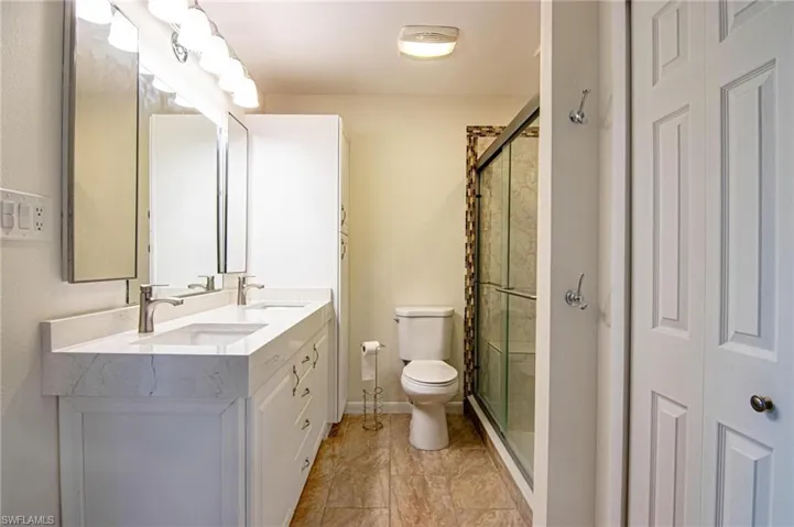 Primary bathroom Fully updated with dual sinks, granite counter tops, cabinetry and shower!