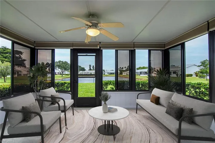 Virtually staged Sun Room which overlooks the lake.