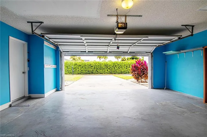Automatic garage door opener and storage shelving.