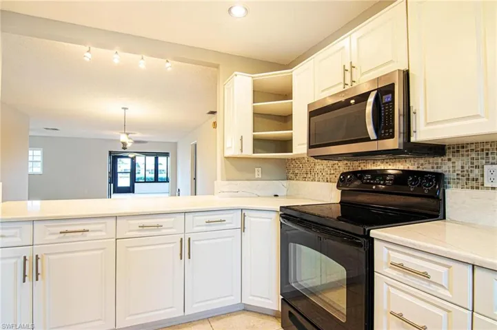 Large breakfast bar opens to the large family and Florida Sun room