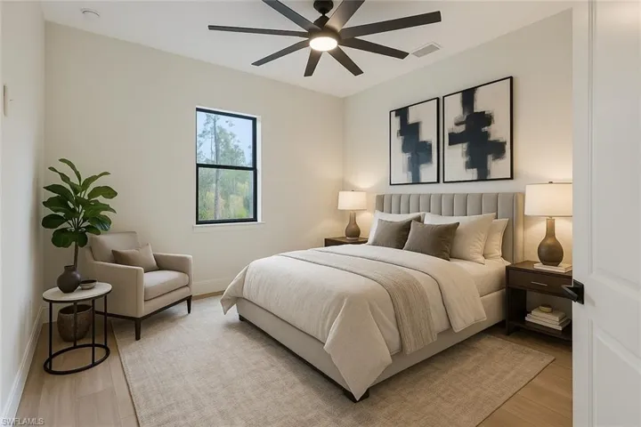 Bedroom featuring ceiling fan, baseboards, visible vents, and light wood-type flooring