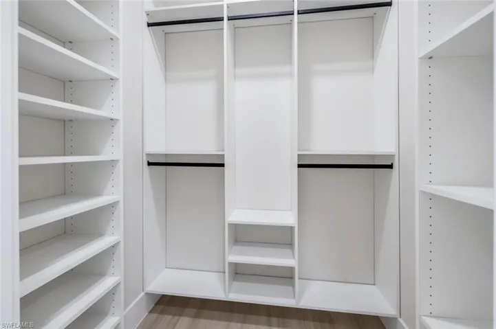 Spacious closet with wood finished floors