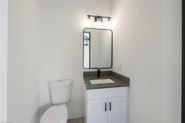 Half bath with toilet and vanity