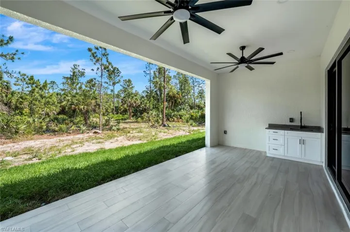 View of patio / terrace with a sink and a ceiling fan