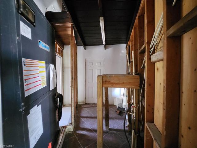 Mechanical Room, Washer + Dryer, Additional Door to Patio Area