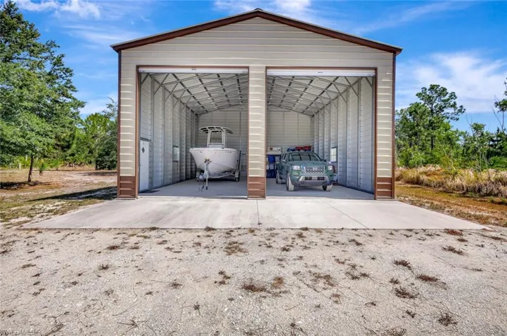 View of outdoor structure with an outbuilding
