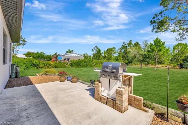 View of patio featuring area for grilling