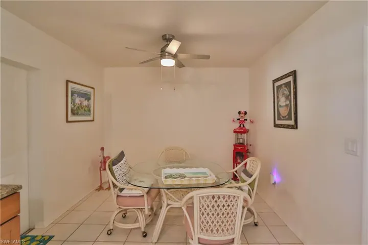 Tiled dining area with ceiling fan