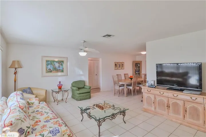 Tiled living room with ceiling fan