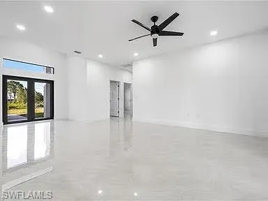 Empty room featuring ceiling fan