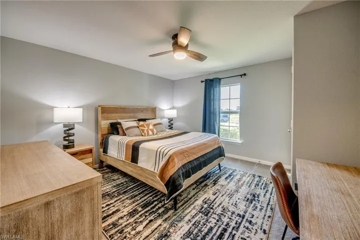 Bedroom with carpet flooring and a ceiling fan