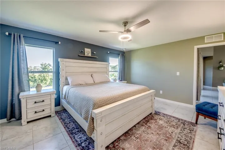 Bedroom featuring ceiling fan and light tile patterned floors