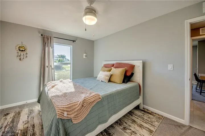 Bedroom featuring carpet flooring and ceiling fan