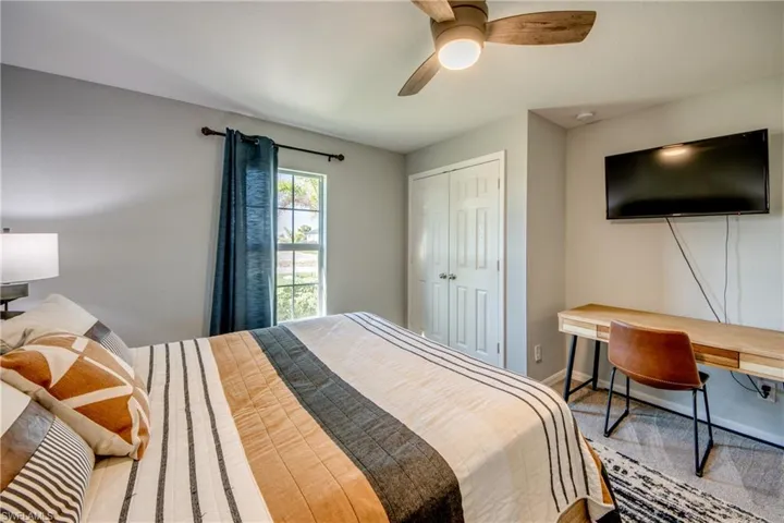 Bedroom featuring a closet and a ceiling fan