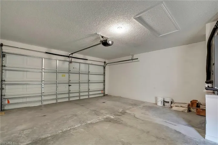 Garage featuring a garage door opener