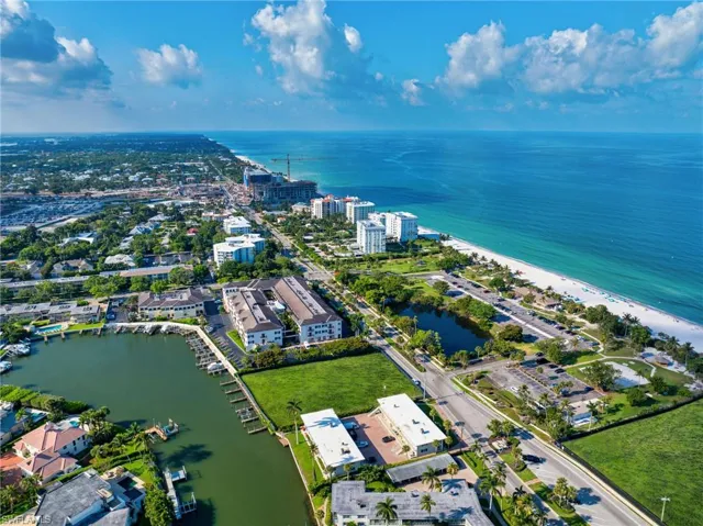 Bird's eye view with a water view and a beach view