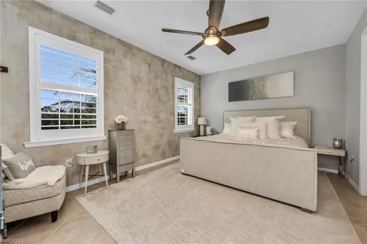 Bedroom featuring ceiling fan and light tile patterned floors