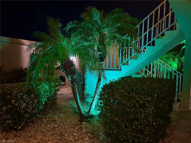 Pretty Tropical, Colorful Courtyard in Front of Unit with Stairs to 2nd. Floor. All Lit Up at Night!!