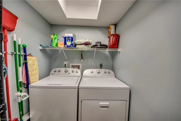 Spacious Laundry Room with Shelving.