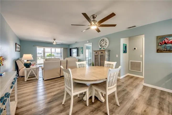 Dining space featuring ceiling fan and light wood-type flooring