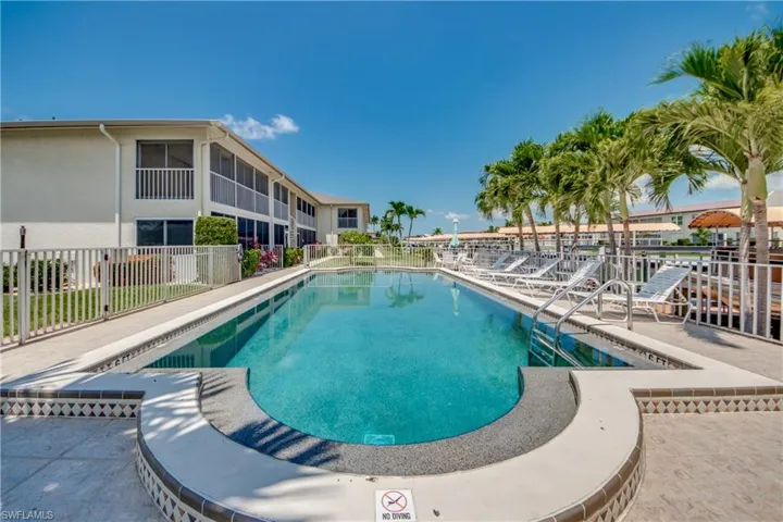 View of Sparkling Swimming Pool That Overlooks Gulf Access Canal.
