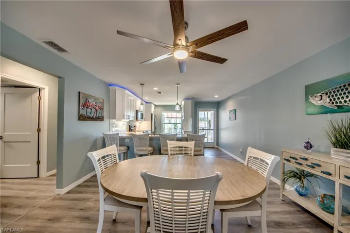 Dining space featuring ceiling fan and light hardwood / wood-style floors
