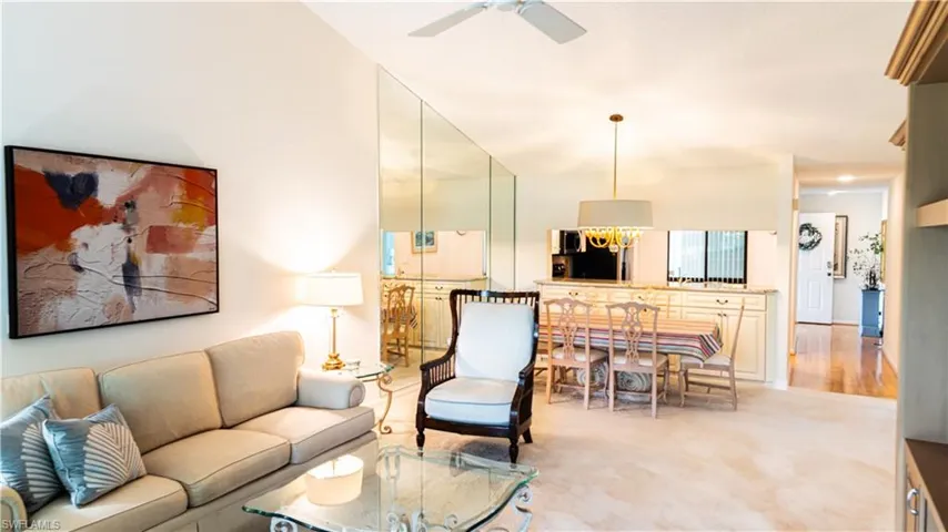 Living area featuring a ceiling fan