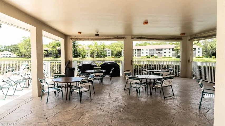 View of patio / terrace featuring outdoor dining area and radiator heating unit