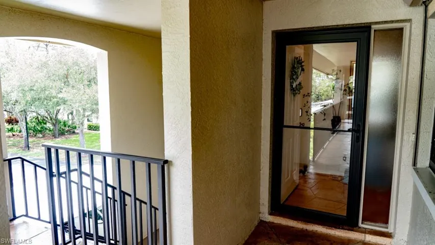 Doorway to property with stucco siding