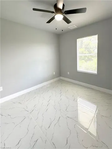 Spare room featuring ceiling fan