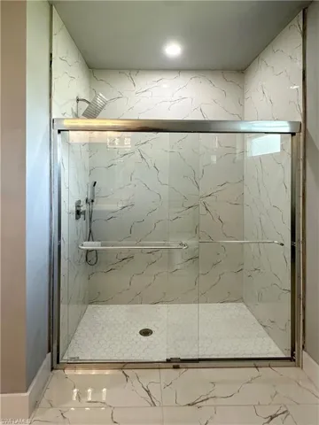Bathroom with a shower with shower door